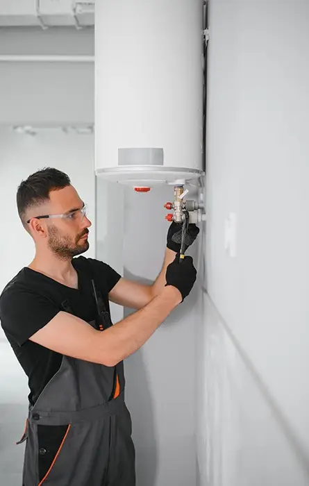 Plumber Performing Commercial Boiler Repair in Modern Facility